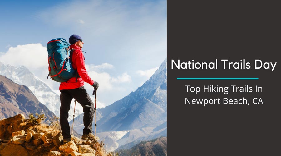 person hiking standing at the top of a ridge