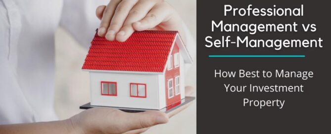 person holding a toy house between their hands