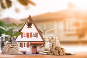 Model House with Coins money bag and coins at the side