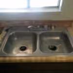 Kitchen Sink, before shot of a worn, dirty kitchen sink