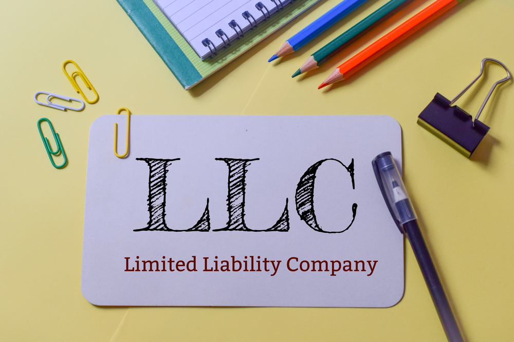 LLC (Limited Liability Company) text writing in a piece of paper